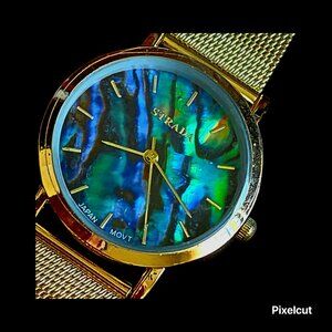 NEW Woman's gold colored buckle watch with abalone colored face.